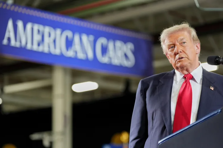 Trump defends his tariffs during Michigan visit even as businesses say they've hurt the state